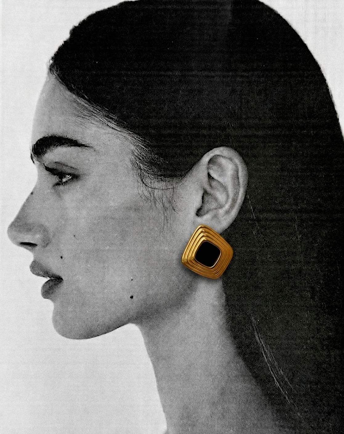 Lilouette gold square earring worn in a black and white portrait